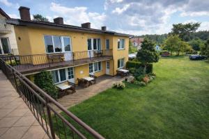an aerial view of a house with a yard at Nella - Pokoje gościnne in Ostrowo
