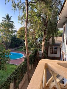 a view from the balcony of a house with a swimming pool at The Paradise Inn Kilimanjaro in Moshi
