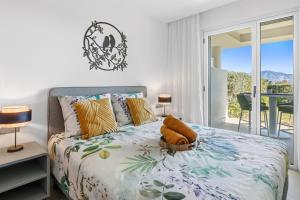 a bedroom with a bed with a view at Solana Village in Málaga