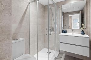 a bathroom with a shower and a toilet and a sink at Solana Village in Málaga +41 photos