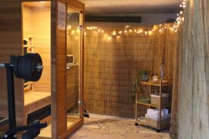 a bathroom with a shower with lights on it at Chata na Bunči in Roštín +14 photos