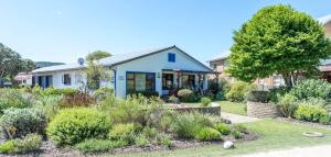 a house with a garden in front of it at Estuary Breeze in Sedgefield