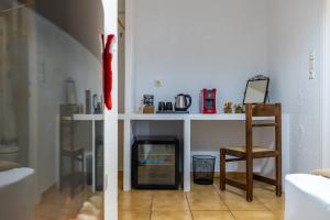 a living room with a table and a chair at Rigas Hotel Arachova in Arachova +139 photos