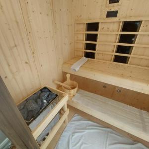 a wooden room with a bunk bed in it at Chata Strbianka in Tatranska Strba