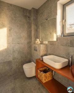 a bathroom with a sink and a toilet at Chata Hrbánik Tále in Bystrá +16 photos