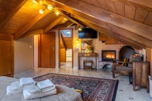 a large room with a bed and a fireplace at Rigas Hotel Arachova in Arachova