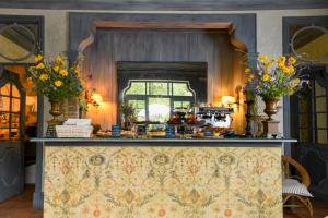 a kitchen with a counter with flowers on it at Convento de Cabanas in Viana do Castelo