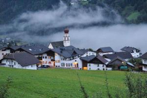 a town with a tower on top of a hill at Apartment Jerzens 1 in Jerzens