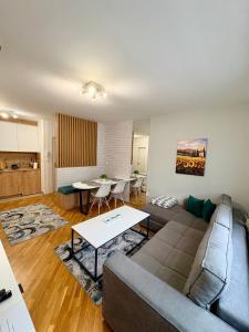 a living room with a couch and a table at Apartman Matija in Pale