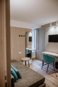 a hotel room with a bed and a mirror at Hotel Venezia in Trento