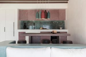 a living room with a table and some vases at Seriphos Estate in Serifos Chora