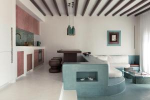 a living room with a couch and a table at Seriphos Estate in Serifos Chora