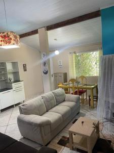 a living room with a couch and a table at Pousada Chuá Chuá in Conservatória