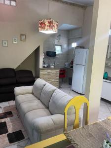 a living room with a couch and a kitchen at Pousada Chuá Chuá in Conservatória +29 photos