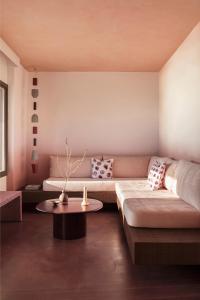 a living room with a couch and a table at Seriphos Estate in Serifos Chora