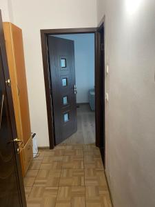 an open door to a bathroom with a toilet at Studio in Drobeta-Turnu Severin