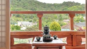 a coffee maker sitting on a table on a balcony at Yeosu Elon Pension in Yeosu +5 photos