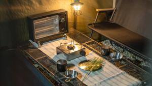 a table with pots and pans on top at Yangyang Lira Camp in Yangyang