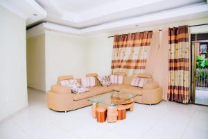 a living room with a couch and a table at Stella nova motel in Kigali
