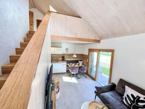 a living room with a couch and a kitchen at Apartment Kinast - HFT202 by Interhome in Hofstetten