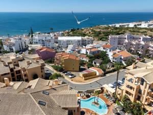 an aerial view of a city with buildings and the ocean at Estrela Apartment by Moje Holiday in Luz