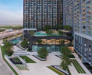 an overhead view of a building with a courtyard with trees at Mega Bangna Studio Retreat in Bang Kew Yai