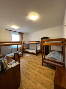 a room with three bunk beds and a desk at Romeo&Julia in Toruń +121 photos