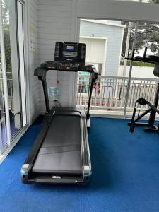 a treadmill sitting on a porch with a balcony at Wilfrid villa in Hua Hin