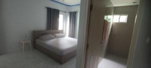 a small bedroom with a bed and a window at Wilfrid villa in Hua Hin +34 photos