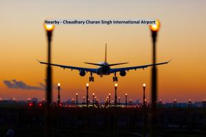 an airplane is taking off from an airport at Super Hotel O by OYO Surya Continental in Lucknow