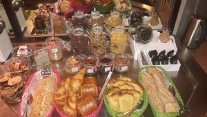 
a table filled with lots of different types of food at Contact Hotel ALYS Bourg en Bresse Ekinox Parc Expo in Montagnat
