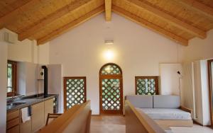 an open kitchen and living room in a house at Albergo Diffuso Tolmezzo in Tolmezzo