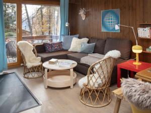 a living room with a couch and two chairs at Apartment Entremont 60 by Interhome in Verbier