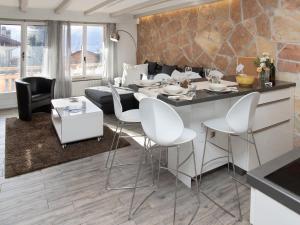 a kitchen and living room with a table and chairs at Apartment Stem 2 by Interhome in Verbier
