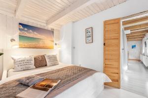 a bedroom with a bed and a view of the ocean at Landhaus Sofie in Kreischa