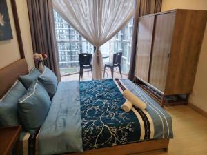 a bedroom with a large bed and a large window at Timurbay Seafront By Moonlight Sea & Poolview in Kuantan +27 photos