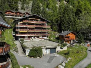 an aerial view of a large building in the mountains at Apartment Parc C013 by Interhome in Champex