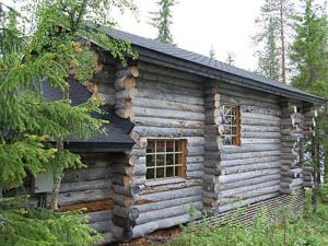 a log cabin with two windows on the side of it at Holiday Home Rantapuro by Interhome in Joutsenniemi