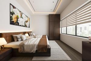 a bedroom with a bed and a window at De' Mon Villa in Làng Tong Tchoung