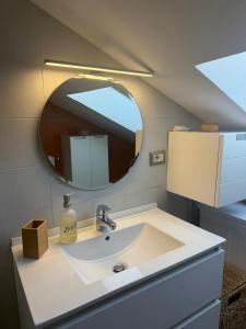 a bathroom with a sink and a mirror at Avigliana Einaudi in Avigliana