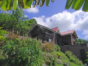 a house sitting on top of a hill at Villa THEOROM in Chambort +8 photos