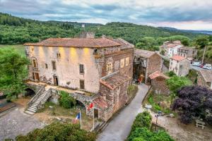 an aerial view of an old building in a village at Chateau de Latour sur Sorgue in Latour
