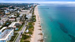 an aerial view of a beach and the ocean at Oceans Beach Resort 735 in Deerfield Beach