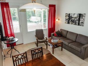 a living room with a couch and a table at Holiday Home Levi star 2- as- 409 by Interhome in Levi