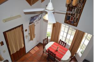 a room with a table and a chair and a door at Cabañas Quilquelen in Merlo