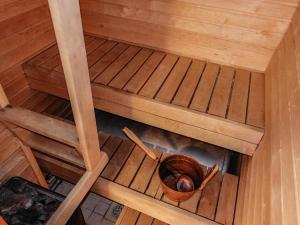 an overhead view of a bucket in a sauna at Holiday Home Levin tuisku by Interhome in Levi