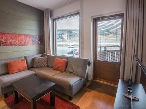 a living room with a couch and a table at Holiday Home Ski chalet 6206 by Interhome in Ylläs