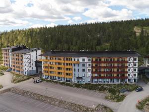 an aerial view of a building with a parking lot at Holiday Home Ylläs chalets 3207 by Interhome in Ylläs