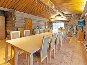 a conference room with a long table and chairs at Holiday Home Metsä-luosto by Interhome in Luosto +37 photos