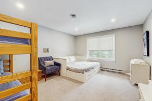 a bedroom with a bunk bed and a window at Fawn Ledge in Jamaica